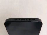 the back of a black iphone with a small screen on top of it