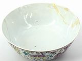 a white bowl with a floral design on it