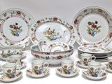 a lot of plates and cups and saucers on the table