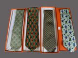 three ties in a box with a tie in the middle of them