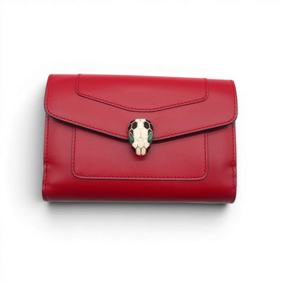 a red purse with a skull on the front