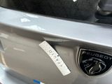 a sticker on the bumper of a car that has a sticker on it