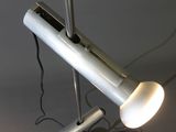 a lamp that is on a pole in the room