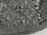 a black purse with a chain on it
