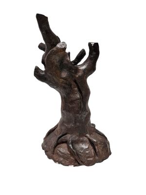 sculpture of a tree trunk with a branch sticking out of it ' s trunk