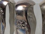 three spoons that are sitting on a glass table