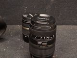 two camera lenses sitting next to each other on a table