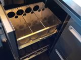 a silver oven that is open in the kitchen