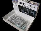a box with a model of a star wars tie fighter