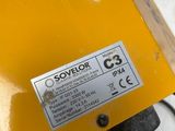 a close up of a yellow object on a white surface