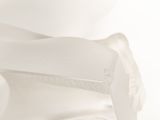 a close up of a white sculpture of a person