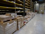 a large warehouse filled with lots of boxes and pallets