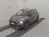 grey citrole parked in a garage with a checkered floor