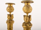 pair of antique brass candlesticks in the shape of a woman ' s head