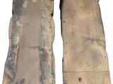 two pieces of wood are sitting next to each other on a white surface
