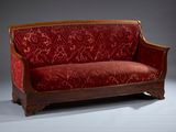 an image of a red couch on a grey background