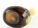 a chocolate egg that is sitting on a white surface