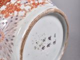 a close up of a vase with a flower design on it