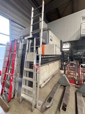 many ladders that are sitting in a building