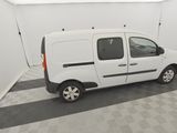 the small white van is parked in a clean room