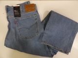 levi ' s light blue jeans are stacked on top of each other