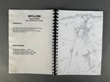 an open notebook with a drawing of a horse on it