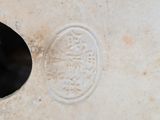 a close up of a vase with a black cat in it