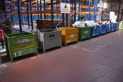 many bins in a large warehouse filled with lots of stuff