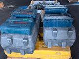 several blue and gray boxes on a pallet in a warehouse