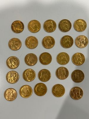 a lot of gold coins on a white surface