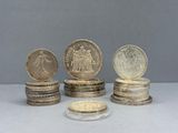 five coins stacked on top of each other on a table