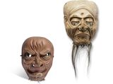 deux masques représentant un homme et une femme sur fond blanc