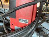 a red and black machine that is sitting on a table