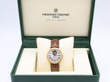 an image of a watch in a box with a bow tie
