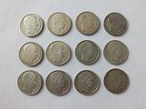 a close up of a bunch of coins sitting on top of a table