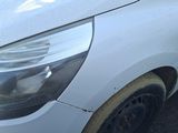 a close up of a car that has a denting on it