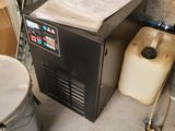 an image of a machine that is sitting in a garage