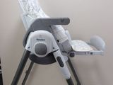 a high chair that is sitting on a table