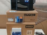 three boxes on top of each other with a printer on top of them