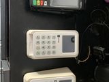 two cell phones on the wall next to each other