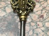 a key that is sitting on a marble table