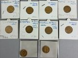 six different types of coins are in small packages on a table