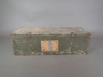 a green box with a label on it sitting on a table