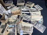 a lot of old photos on the table