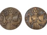 two bronze medallions depicting a woman and a man