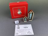 the miniature figurines are in a red box with a card