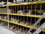 many rolls of paper on the shelves in the warehouse