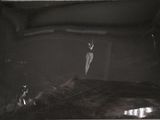 a black and white photo of a person laying in a bed