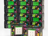 several cubes of different colors and shapes are stacked on top of each other