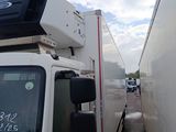 a white truck with a camera on top of it